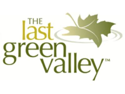Golden green leaf with The Last Green Valley text